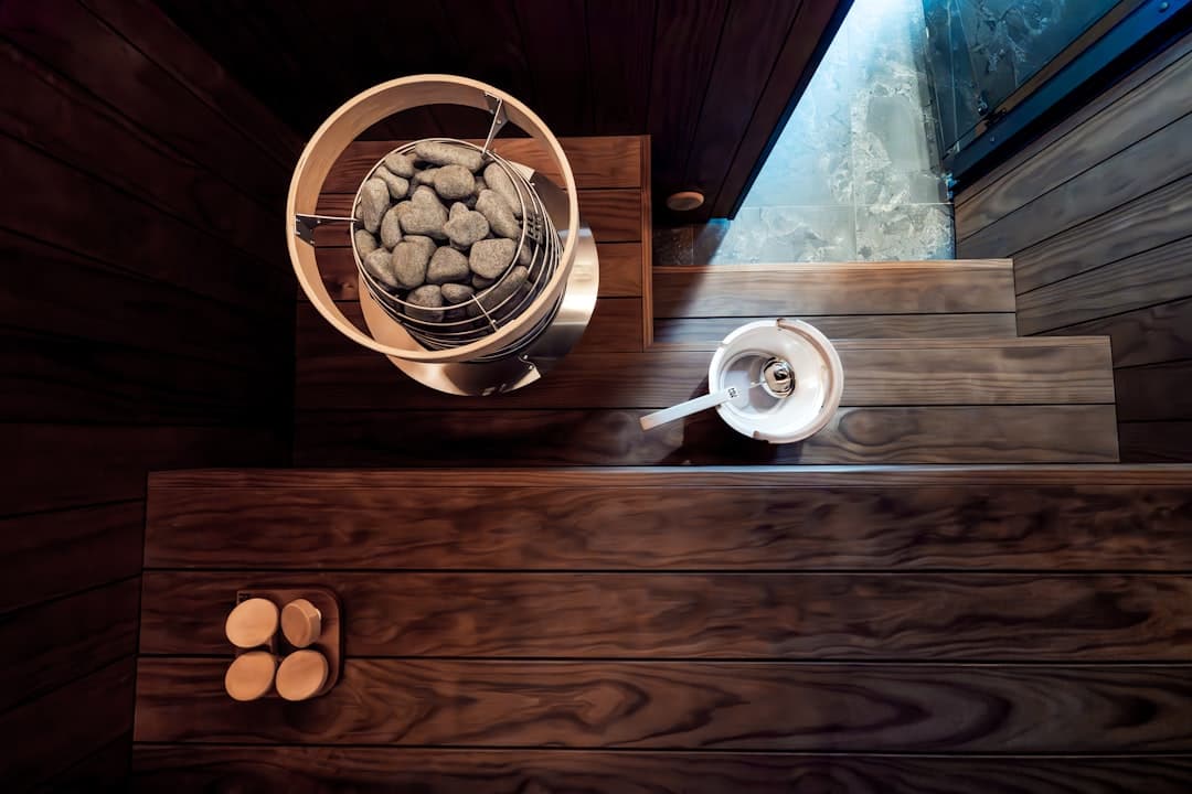 Home spa setup with candles, towels and bath products